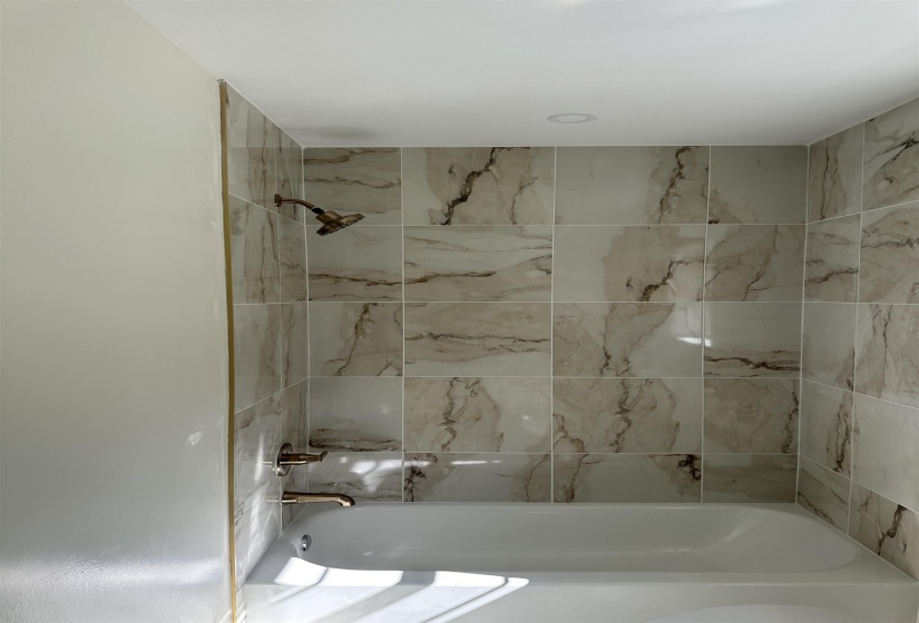 Bathroom featuring shower / bath combination