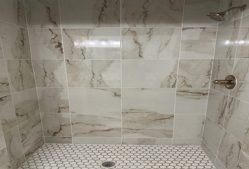 Bathroom featuring a shower stall