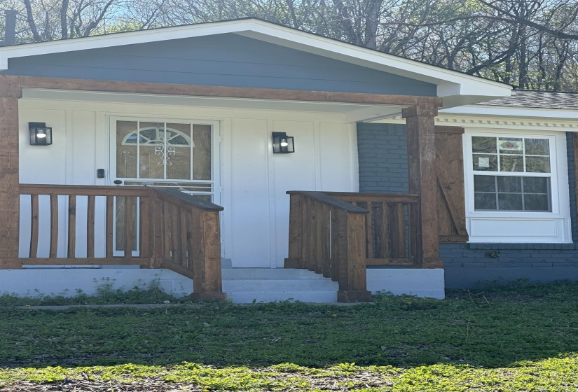 Property entrance with board and batten siding