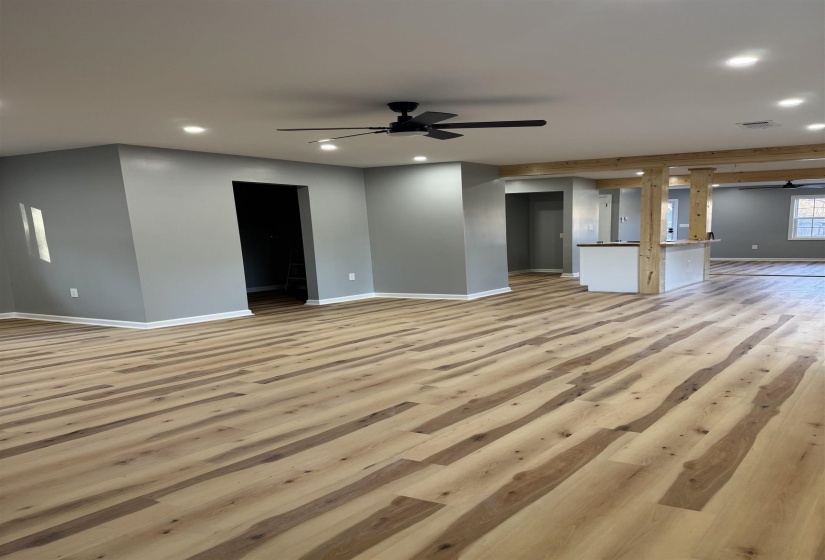 Unfurnished living room featuring light wood-style flooring, recessed lighting, and a ceiling fan