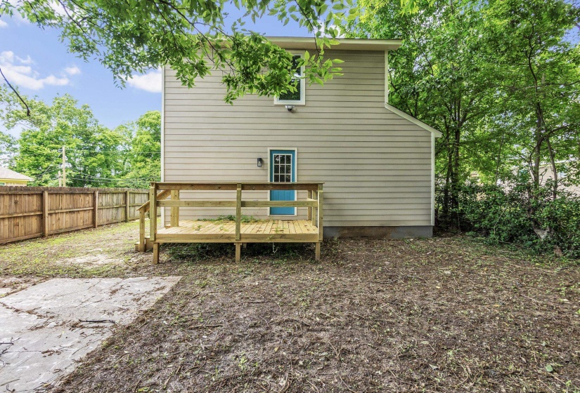 Back of house featuring a deck