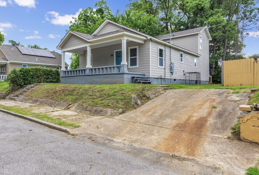View of front of property featuring a porch and a shingled roof