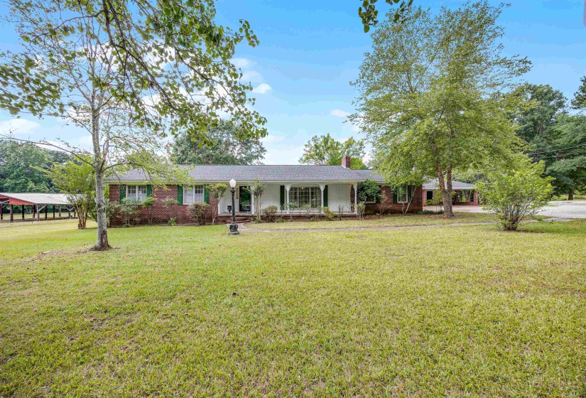 Ranch-style home with a front lawn