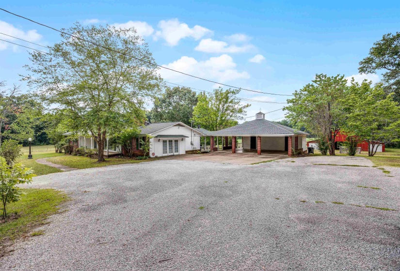 Ranch-style house featuring a carport