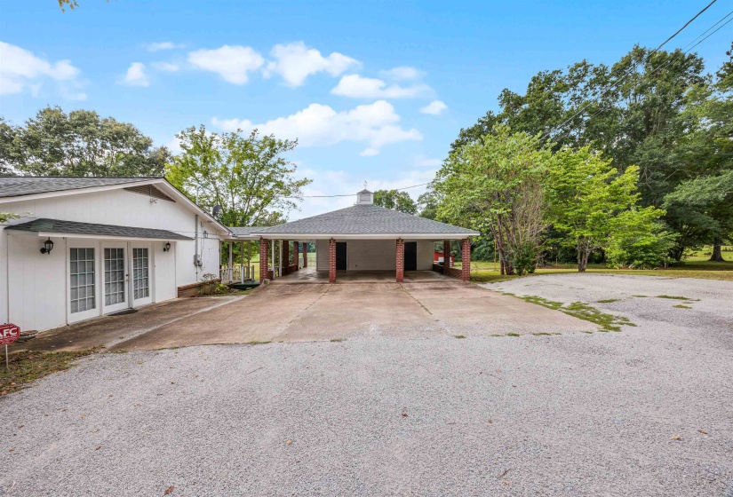 View of front of home with a carport and french doors