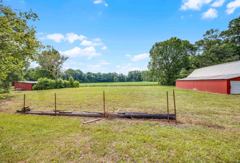 View of yard with an outdoor structure and a rural view