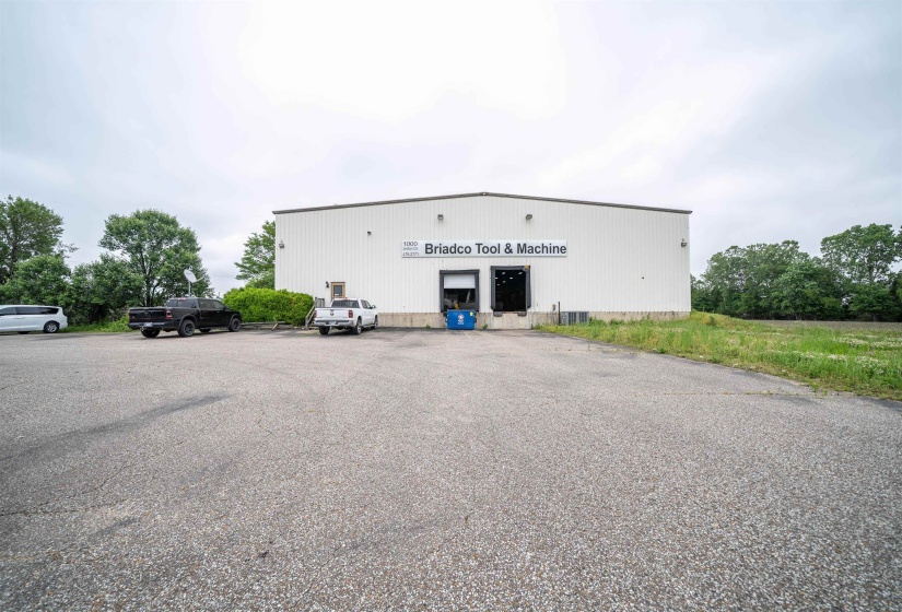 View of property with uncovered parking