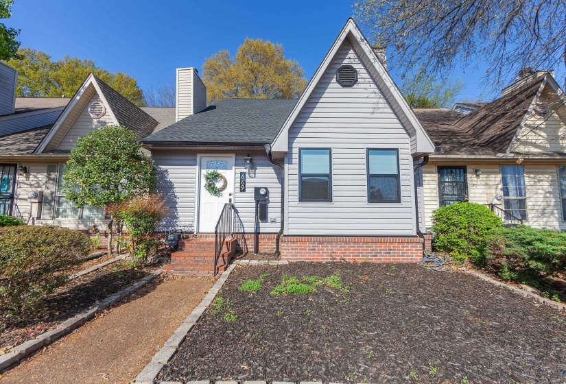 View of front of house featuring a chimney