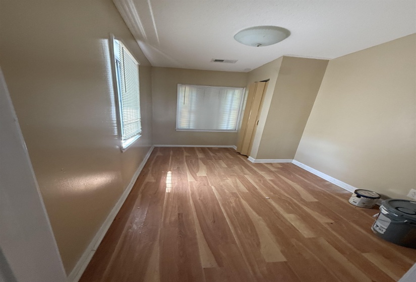 Empty room featuring baseboards and wood finished floors