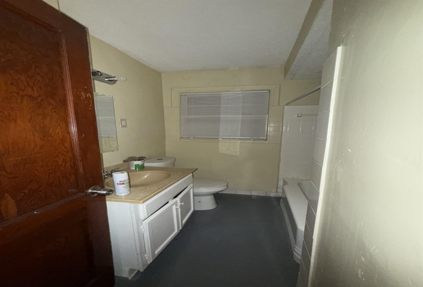 Full bath featuring vanity, toilet, and tub / shower combination