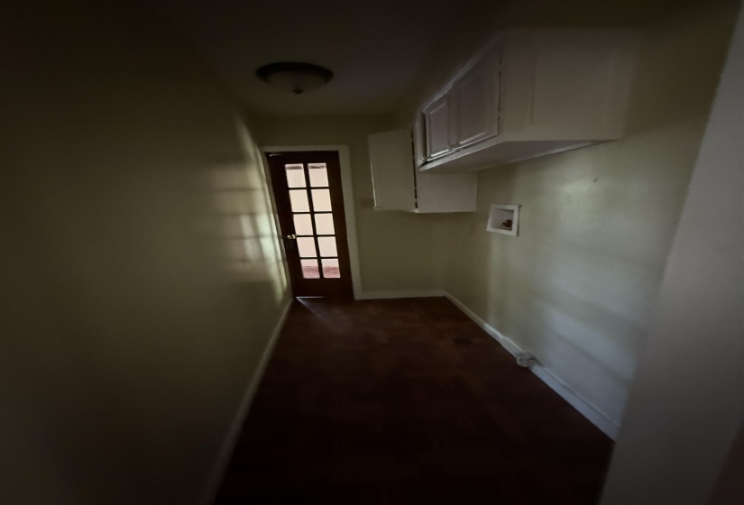 Laundry room with cabinet space, hookup for a washing machine, and baseboards
