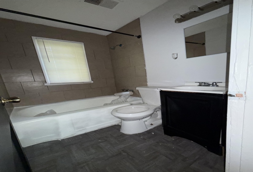 Full bath featuring bathtub / shower combination, vanity, and toilet