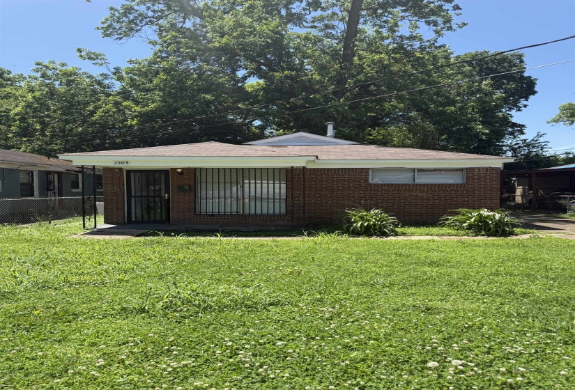 View of front of property featuring brick siding