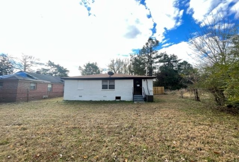 Rear view of house with entry steps