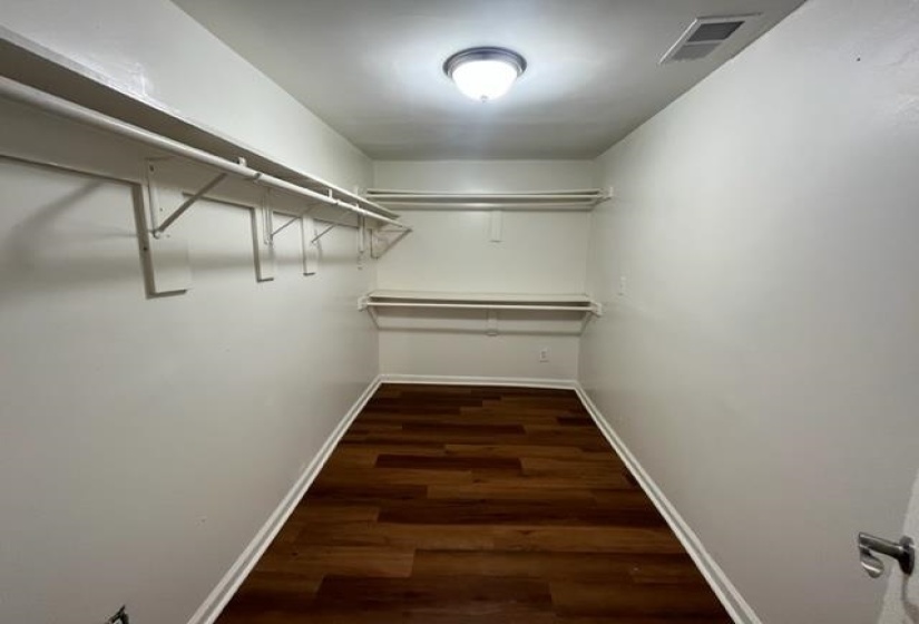 Walk in closet featuring wood finished floors