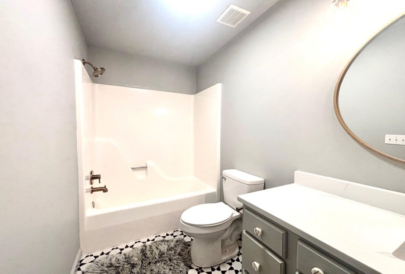 Full bath with toilet, vanity, and bathtub / shower combination