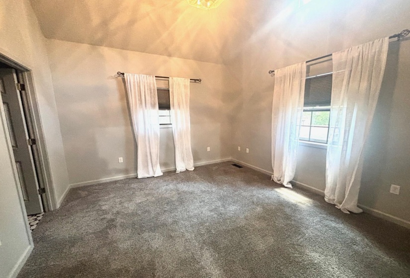 Unfurnished bedroom Featuring large reach in closet and ensuite bath
