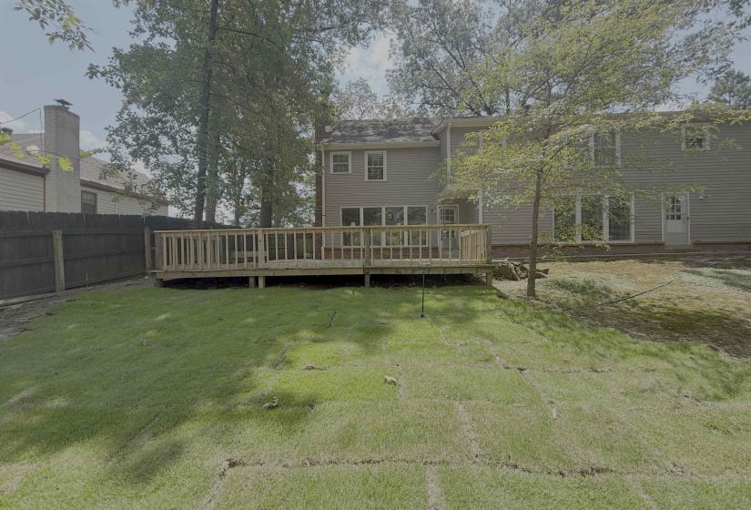 Rear view of property with a wooden deck