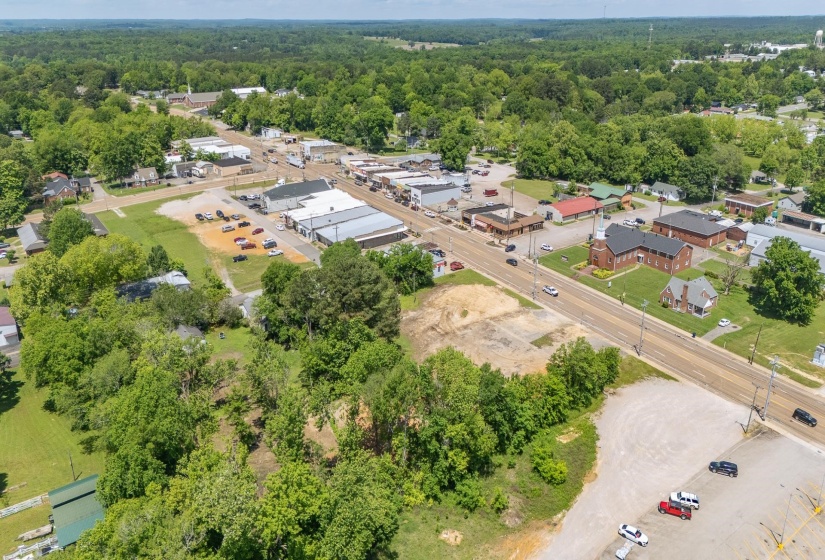 Aerial view of residential area featuring a heavily wooded area