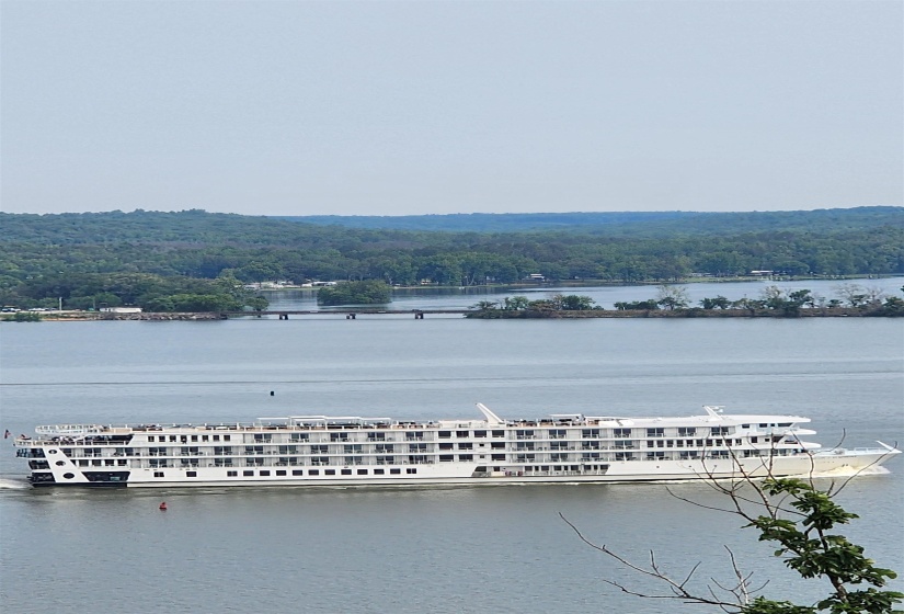 Water view featuring a heavily wooded area