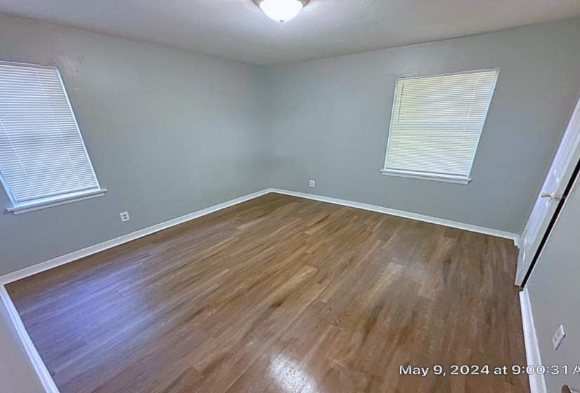 Empty room with wood-type flooring