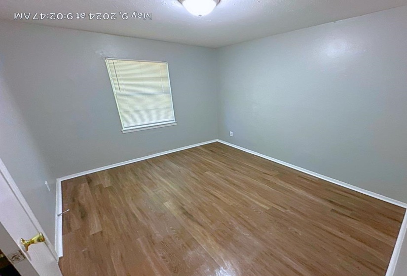 Empty room featuring hardwood / wood-style floors