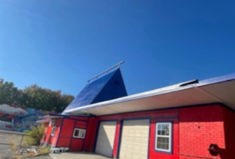 View of side of property featuring a garage