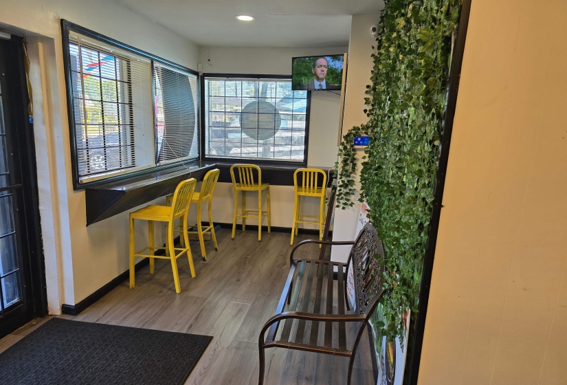 Home office featuring baseboards, wood finished floors, and recessed lighting
