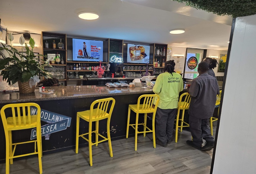 Indoor dry bar featuring wood finished floors