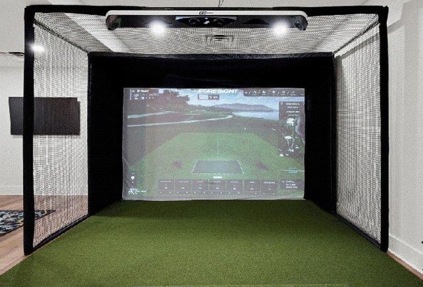 Rec room featuring golf simulator and carpet floors