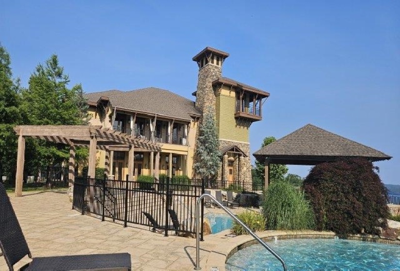 Community pool with a pergola and a patio
