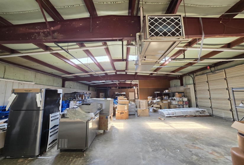 Garage featuring freestanding refrigerator