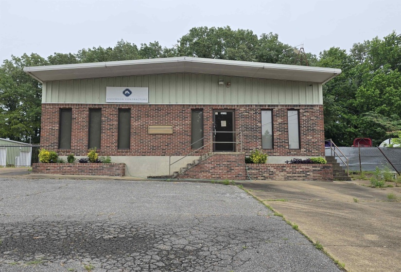 View of front of house featuring brick siding