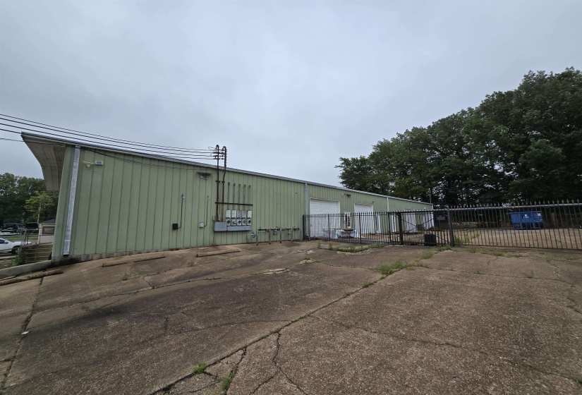 View of property featuring a detached garage