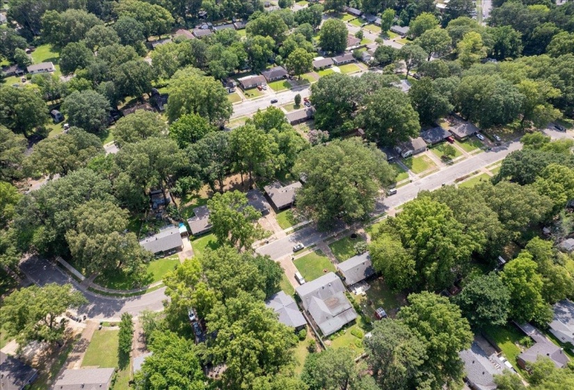Aerial view of property's location with nearby suburban area