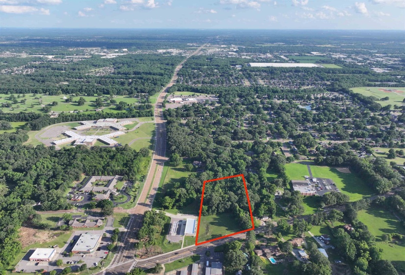 Aerial view of property and surrounding area featuring property boundaries highlighted