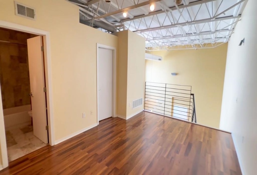 Empty room featuring wood finished floors and baseboards