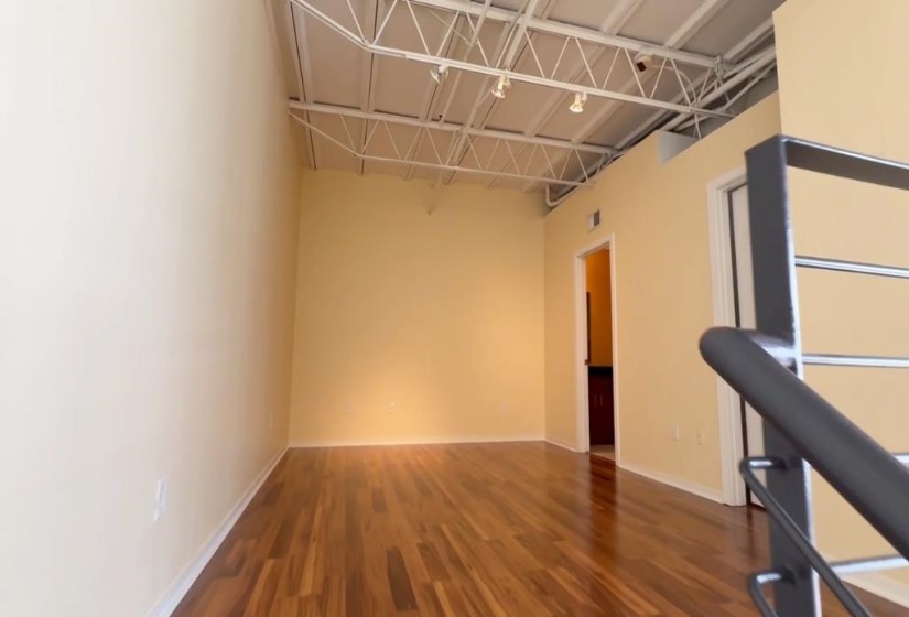 Empty room with baseboards and wood finished floors