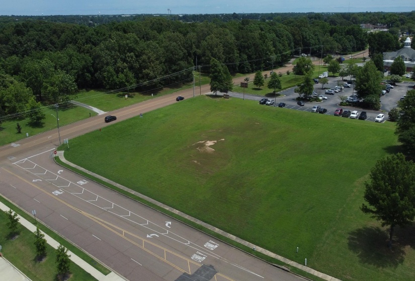Aerial view of property's location featuring a forest