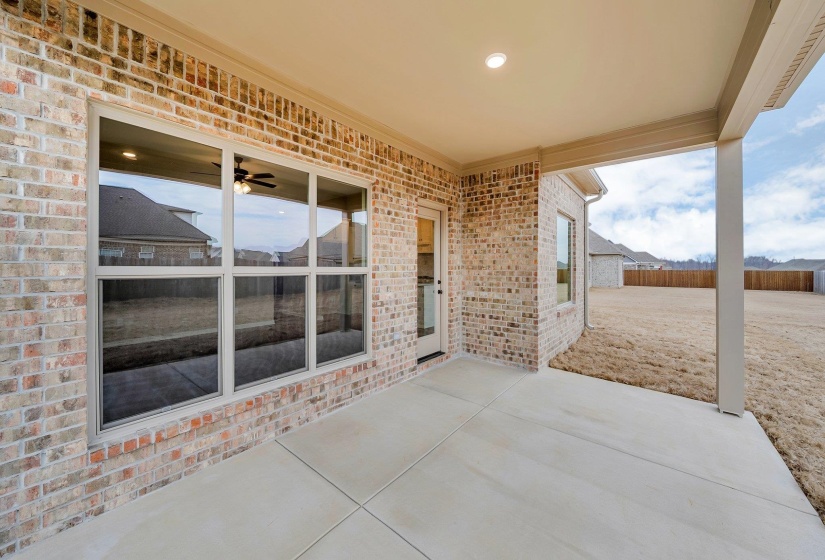 View of patio / terrace featuring fence and ceiling fan