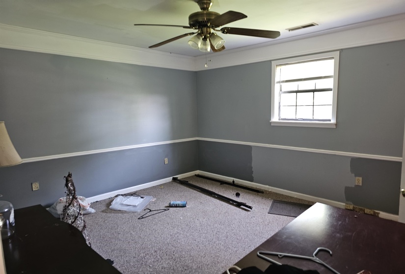 Unfurnished room with carpet floors and ceiling fan