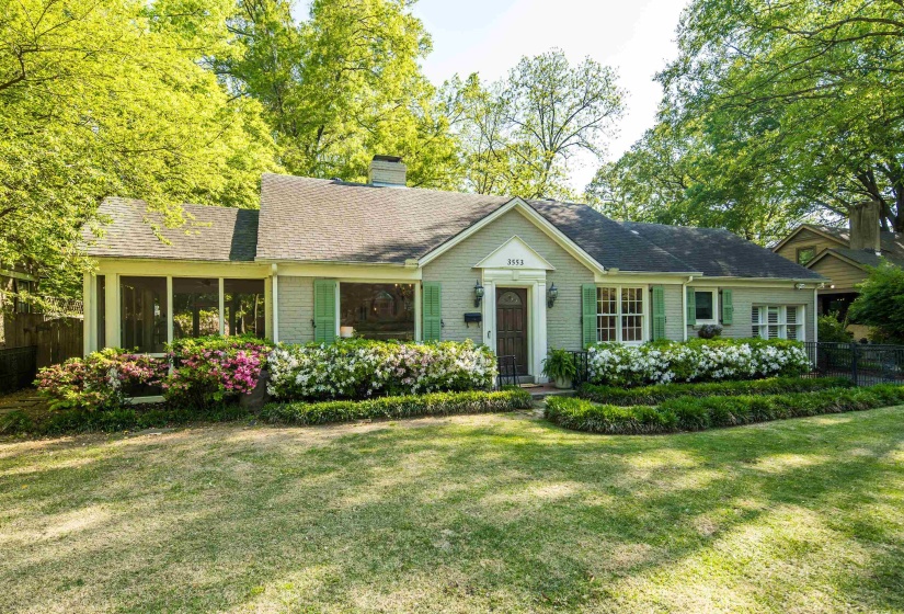 Single story home featuring roof with shingles, a chimney, a front yard, and fence