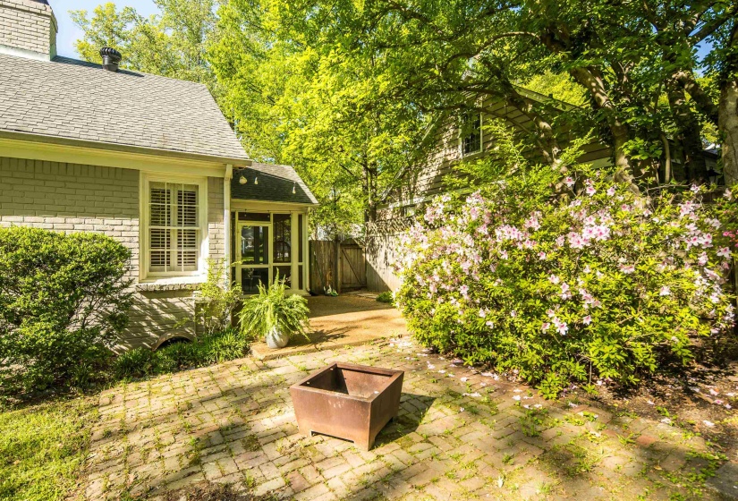 View of yard featuring fence and a patio