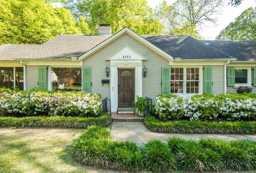 Ranch-style house with brick siding, a shingled roof, and a chimney