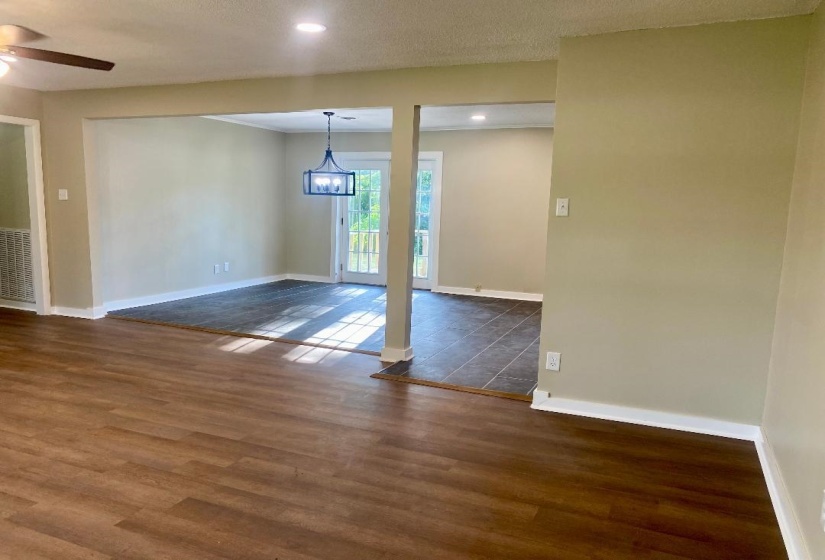 Spare room featuring dark wood-style flooring, a ceiling fan, and recessed lighting