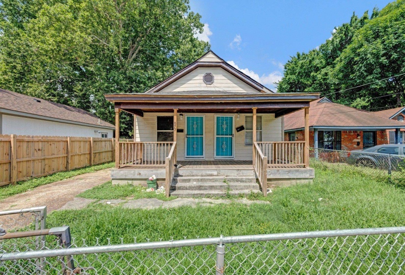 View of front of house with a porch and a fenced backyard