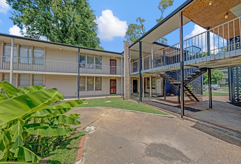 Back of house featuring stairway