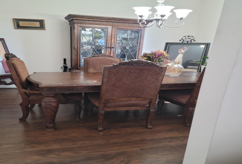 Dining area featuring a chandelier and wood finished floors