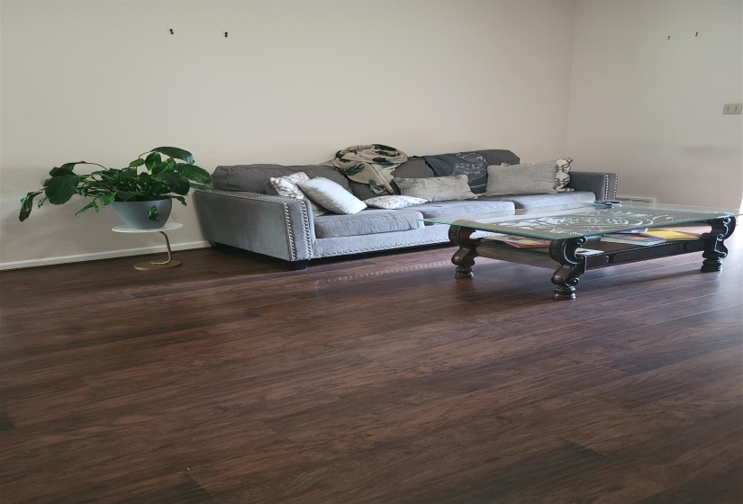 Living room featuring wood finished floors and baseboards