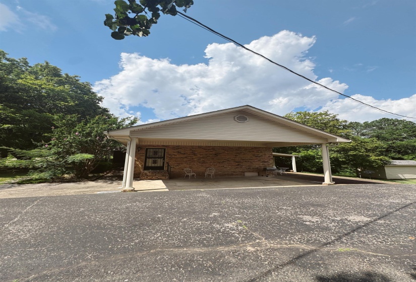 View of property exterior featuring brick siding